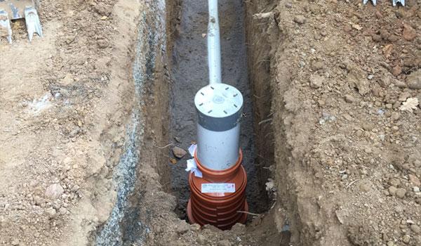Sewer reticulation in the ground.